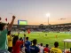 شاهدة مباريات كأس العالم بث مباشر with excited fans cheering in a vibrant stadium atmosphere during a thrilling match.